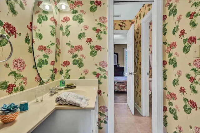 a view of an empty room with a fireplace and a window