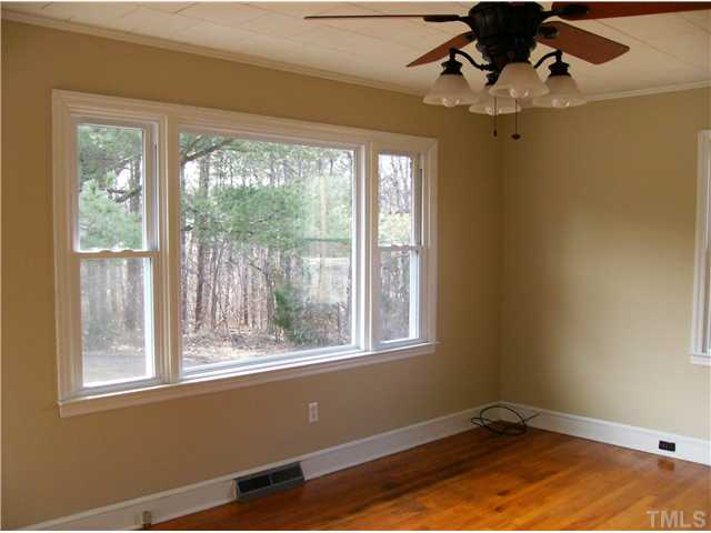 832 Clay Thomas Road Roxboro, NC 27573 - Photo 3 of 13 a view of a room with a window and ceiling fan