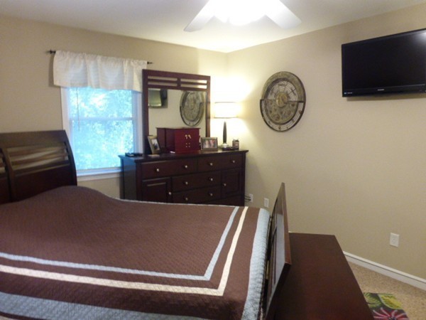 36 Torrey Street Easthampton, MA 01027 - Photo 14 of 20 a view of a livingroom with furniture a flat screen tv and a large window
