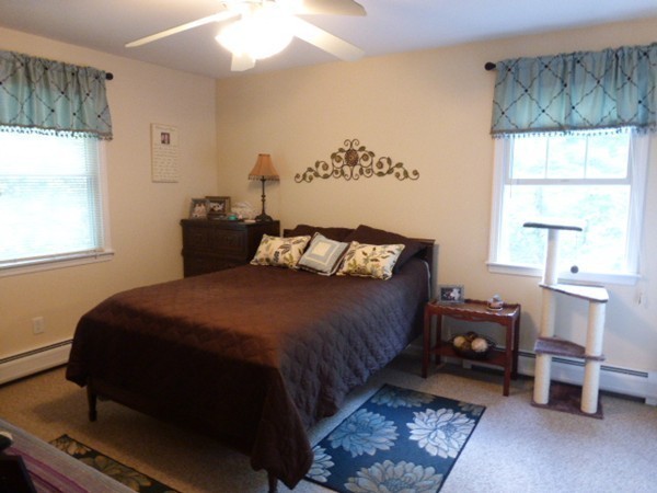 36 Torrey Street Easthampton, MA 01027 - Photo 15 of 20 a bedroom with a bed and wooden floor