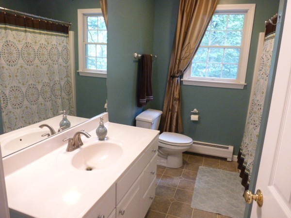 36 Torrey Street Easthampton, MA 01027 - Photo 16 of 20 a bathroom with a sink toilet and window