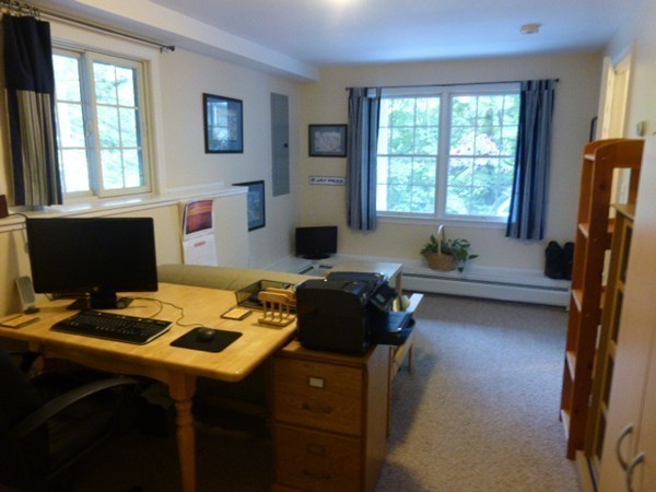 36 Torrey Street Easthampton, MA 01027 - Photo 17 of 20 a room with furniture a window and a flat screen tv