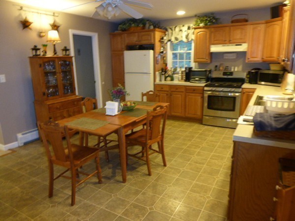 36 Torrey Street Easthampton, MA 01027 - Photo 8 of 20 a kitchen with stainless steel appliances a stove a sink a microwave and a refrigerator