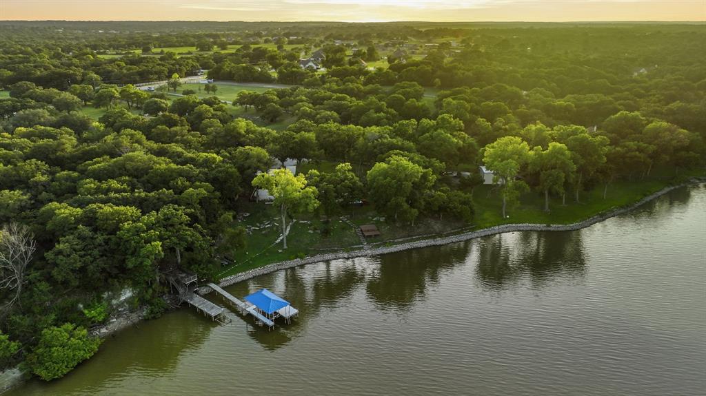 7250 Briar Road Azle, TX 76020 - Photo 40 of 40 Expansive waterfront property featuring a private dock with covered boat slip