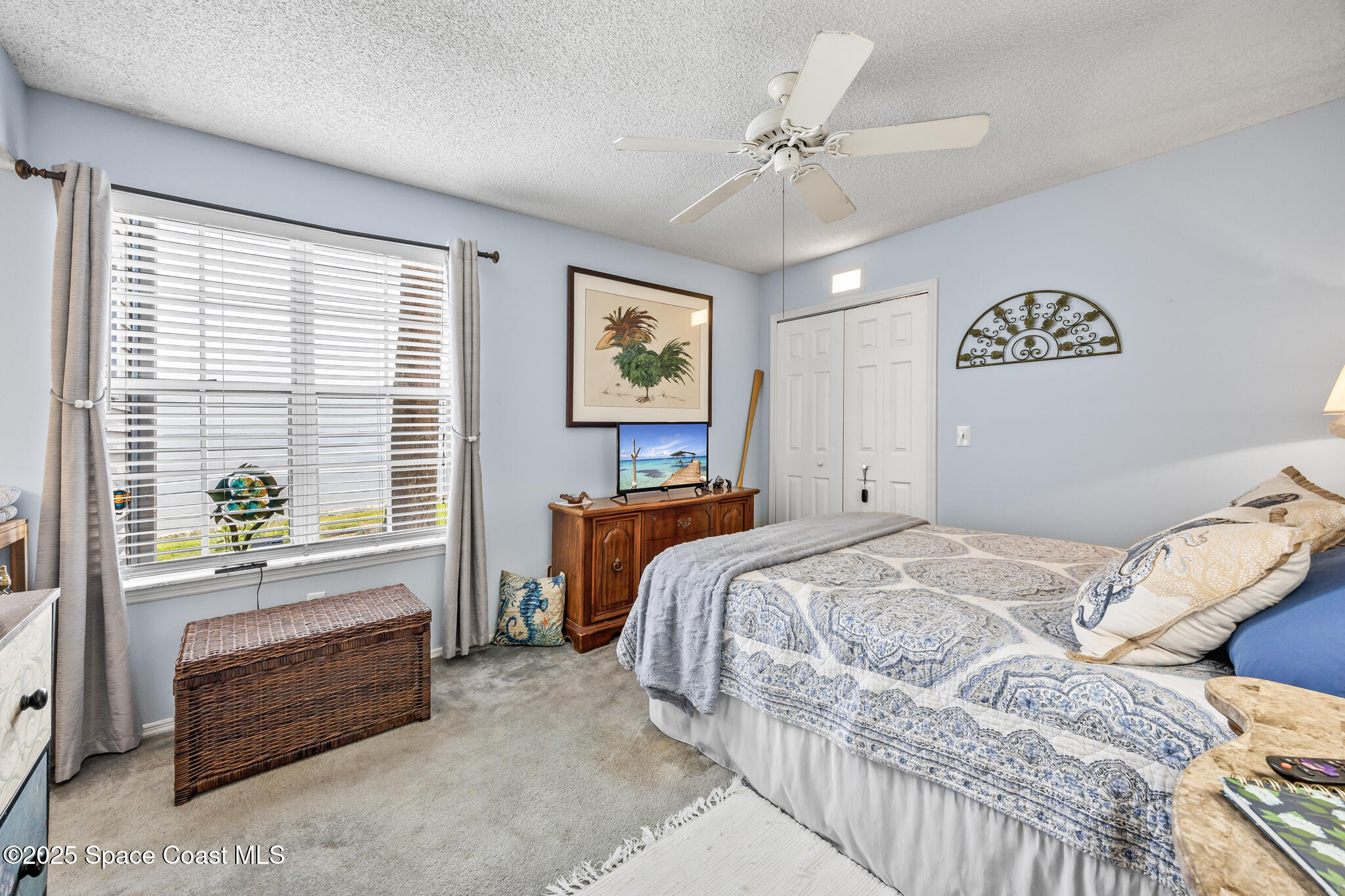 7420 U.S. Rte 1, Unit 106 Cocoa, FL 32927 - Photo 16 of 41 a bed room with a bed and a window