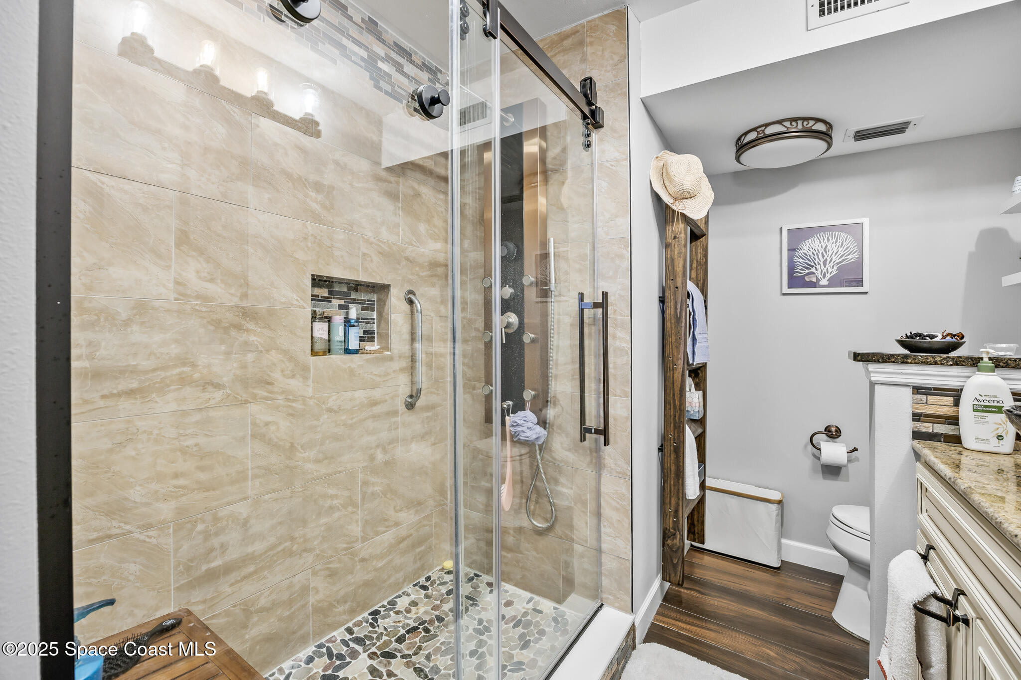 7420 U.S. Rte 1, Unit 106 Cocoa, FL 32927 - Photo 19 of 41 a bathroom with a shower and a glass door