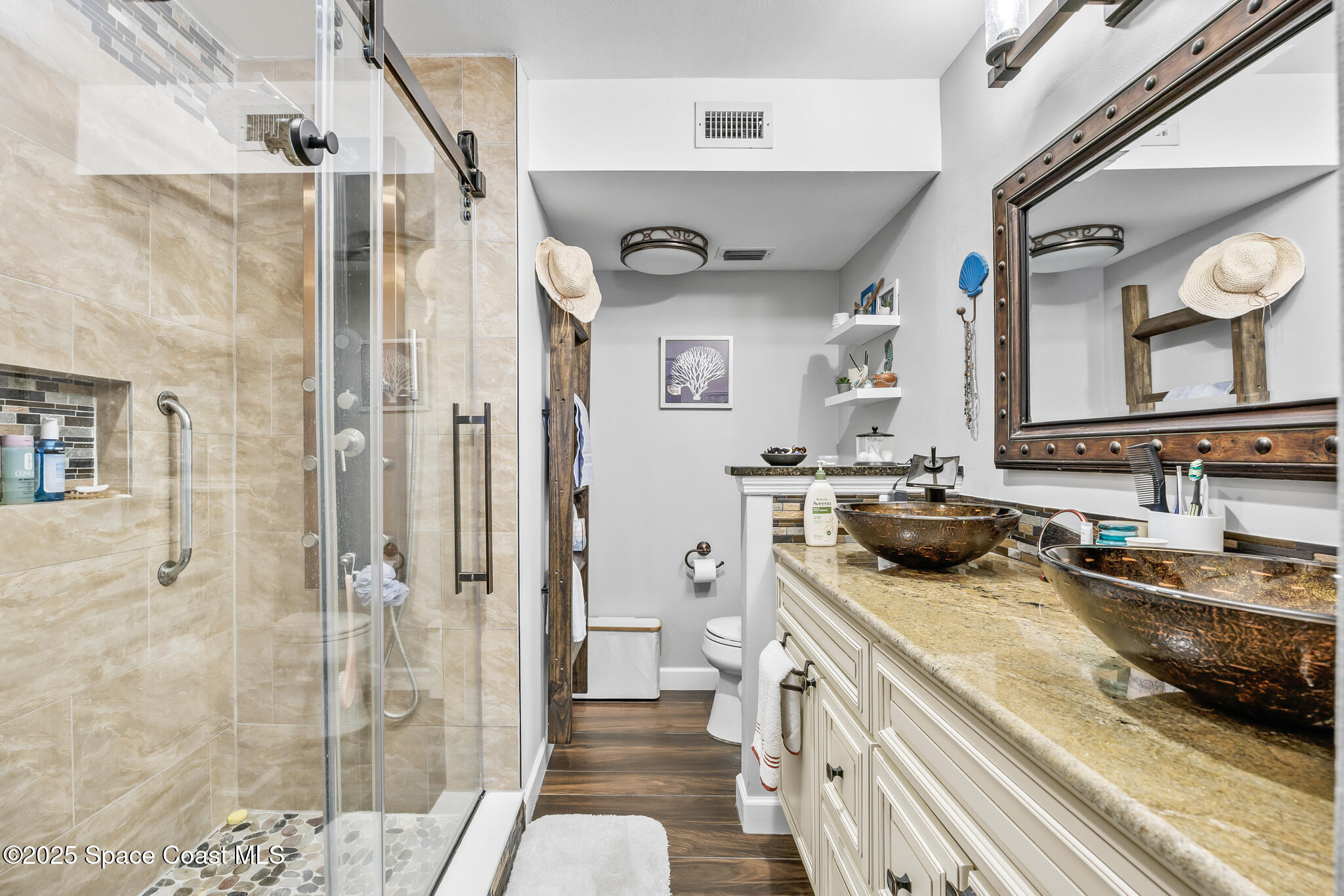 7420 U.S. Rte 1, Unit 106 Cocoa, FL 32927 - Photo 20 of 41 a bathroom with a sink a toilet and shower