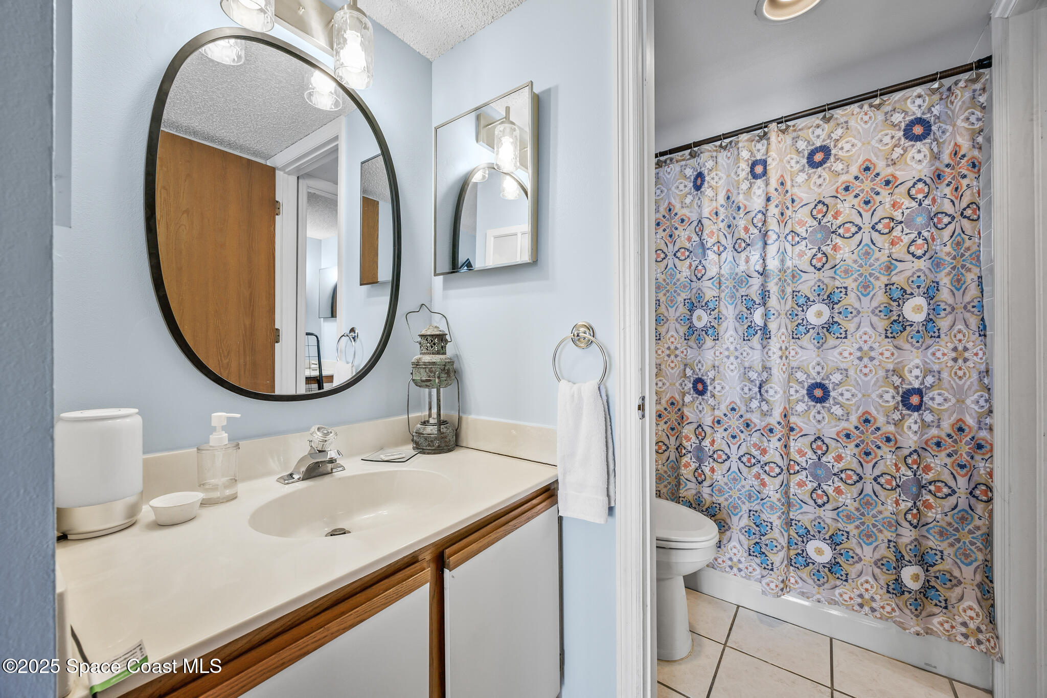 7420 U.S. Rte 1, Unit 106 Cocoa, FL 32927 - Photo 25 of 41 a bathroom with a sink and a mirror