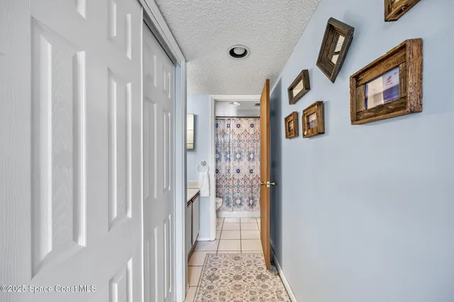a very nice looking room with a white door and a shower