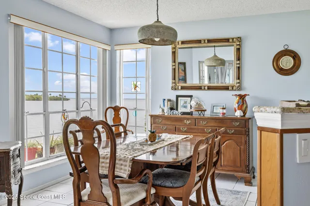 a kitchen with granite countertop a stove a sink dishwasher and cabinets with wooden floor