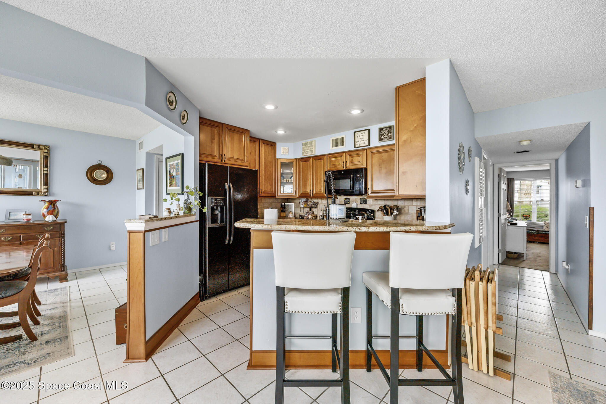7420 U.S. Rte 1, Unit 106 Cocoa, FL 32927 - Photo 36 of 41 a kitchen with appliances cabinets and chair
