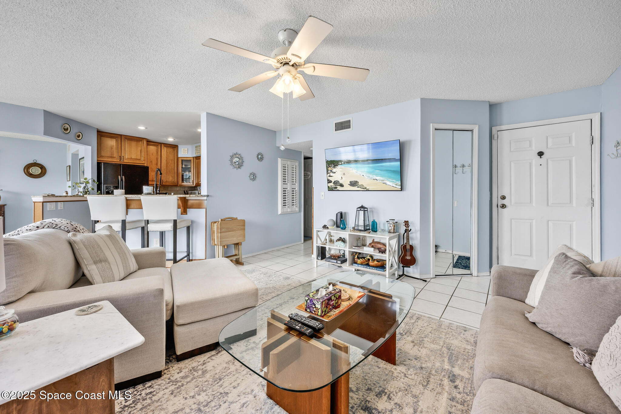 7420 U.S. Rte 1, Unit 106 Cocoa, FL 32927 - Photo 38 of 41 a living room with furniture and a large window