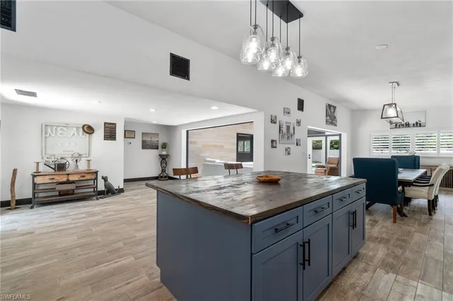 a kitchen that has a lot of cabinets in it