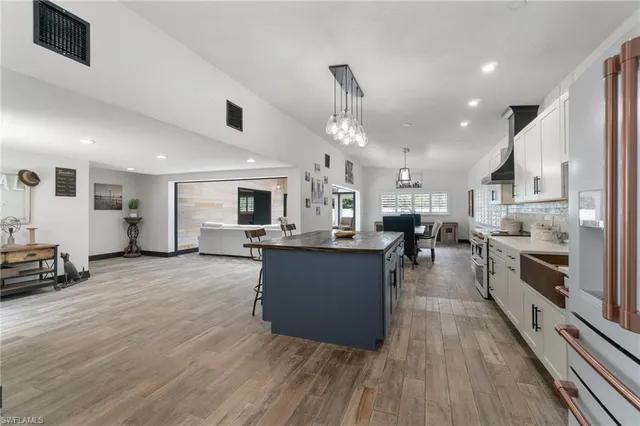 a large kitchen with stainless steel appliances lots of counter top space