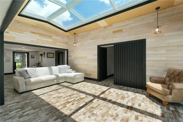 a bedroom with a bed and a chair