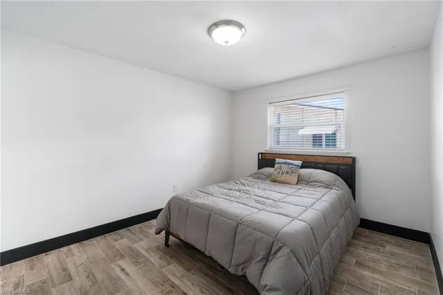 a bedroom with a bed and a chair