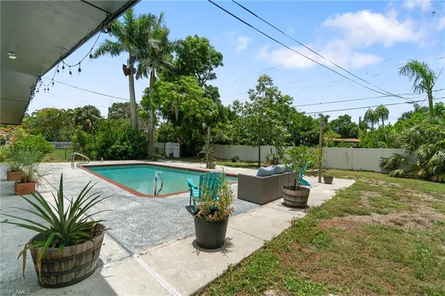a view of a swimming pool with a patio