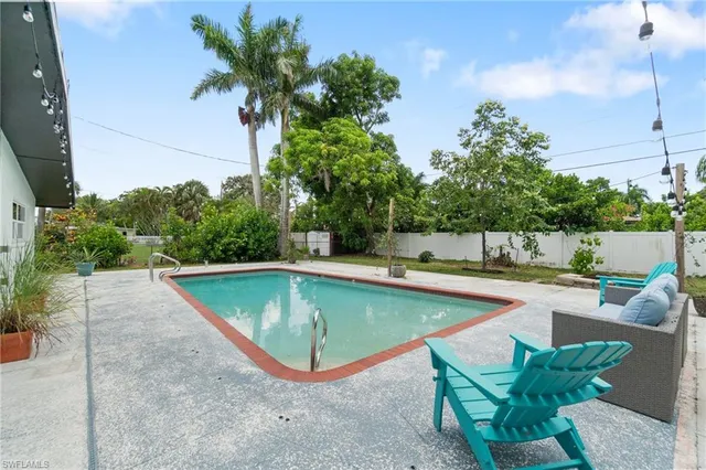 a view of a patio with couches and potted plants
