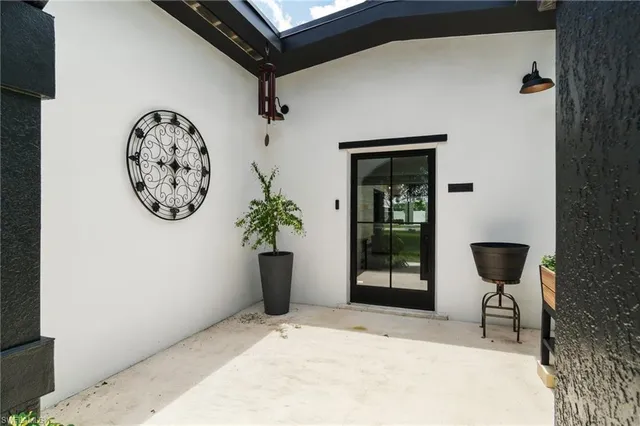 a view of a hallway with paintings on the wall