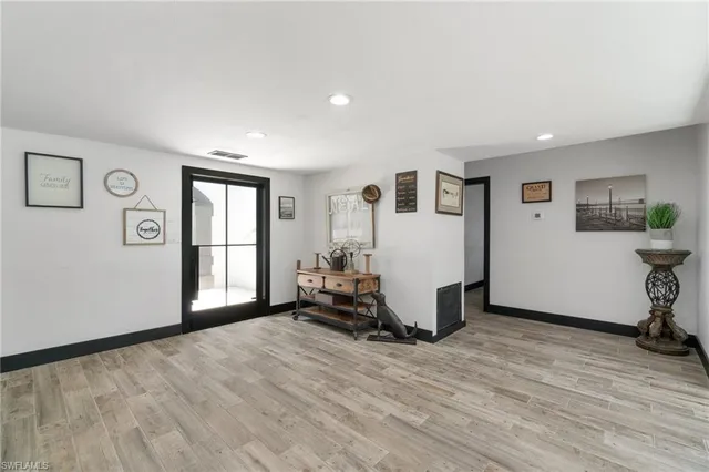 a room with a bed and a window