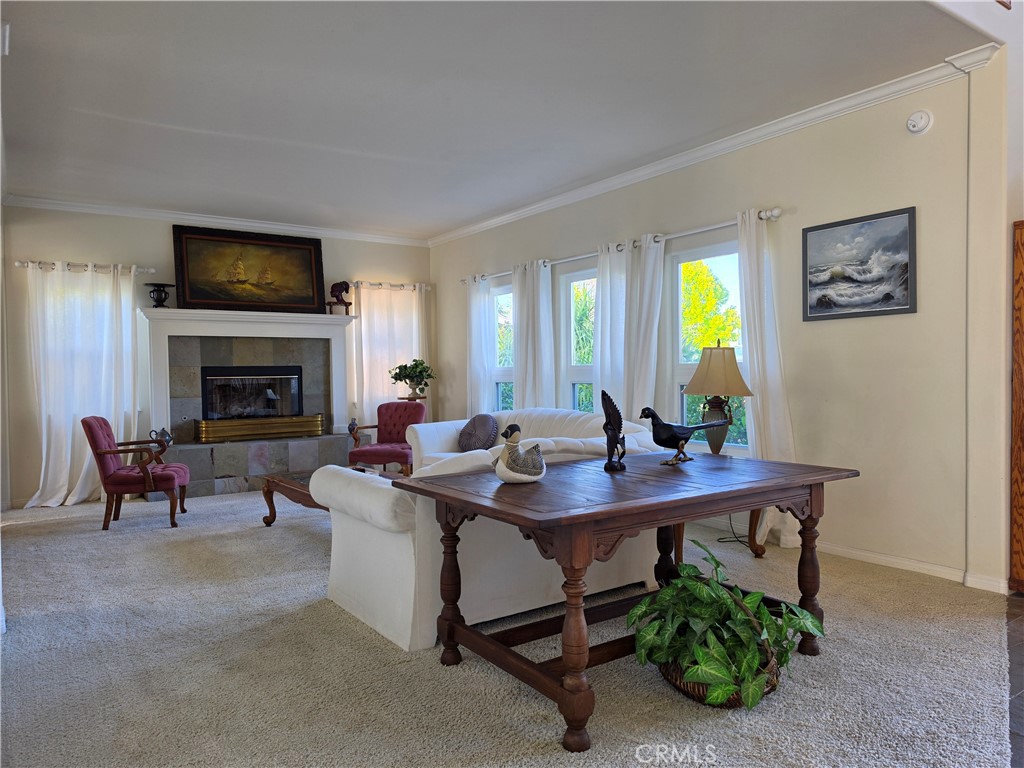 11541 Donovan Road Rossmoor, CA 90720 - Photo 18 of 113 Formal living room off entry with fireplace and high ceilings with crown molding