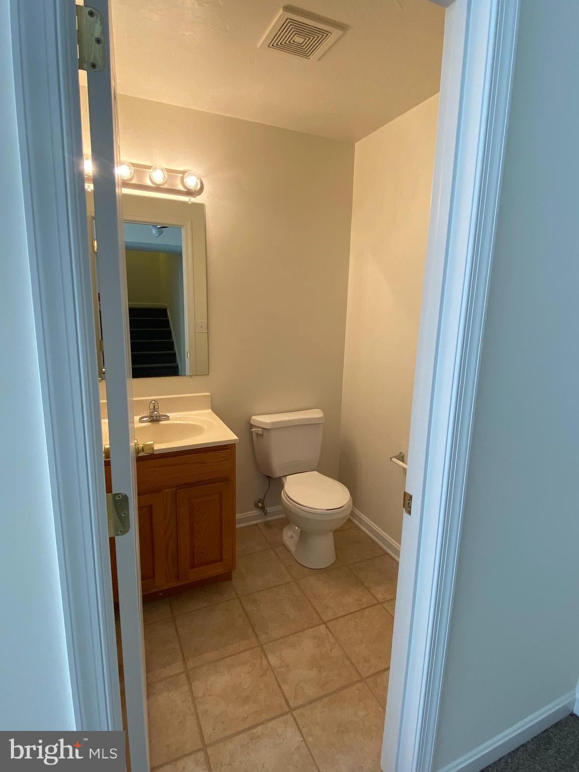 21 Birch Drive Hanover, PA 17331 - Photo 22 of 24 a bathroom with a toilet a sink and mirror