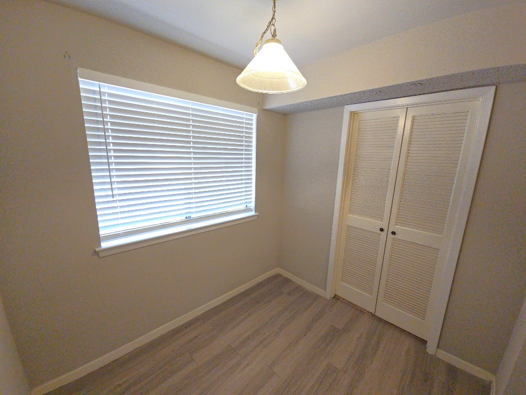 15625 Weldon Drive Houston, TX 77032 - Photo 13 of 25 a view of an empty room with wooden floor and a window