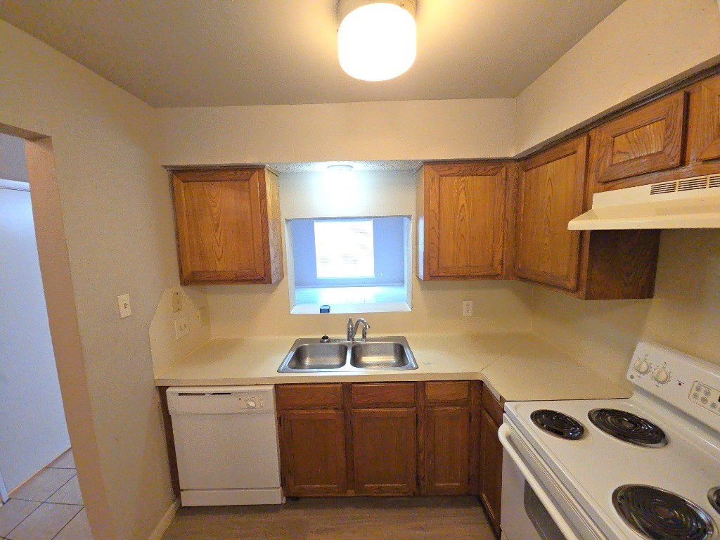 15625 Weldon Drive Houston, TX 77032 - Photo 14 of 25 a kitchen with a sink a stove and cabinets