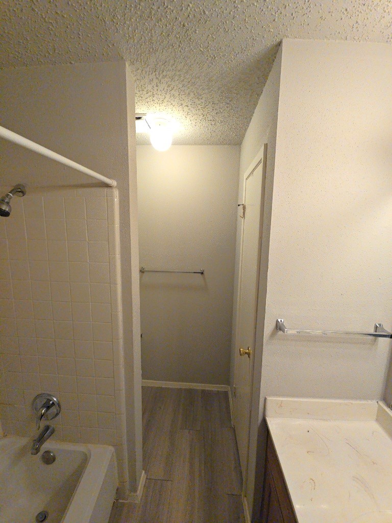 15625 Weldon Drive Houston, TX 77032 - Photo 17 of 25 a bathroom with a tub and shower