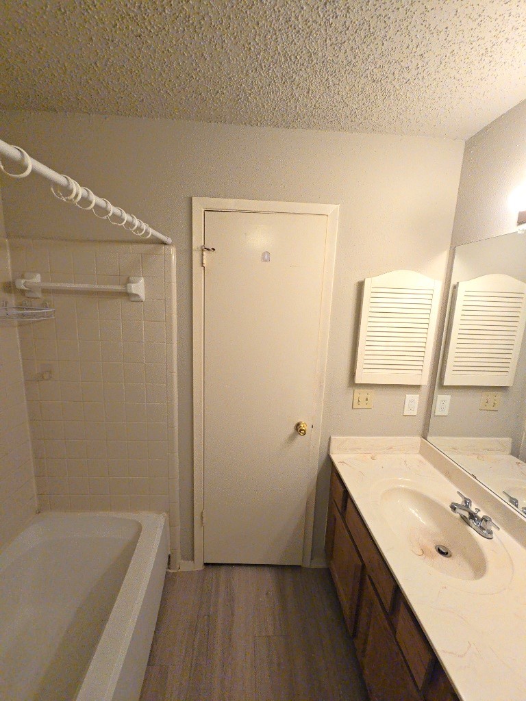 15625 Weldon Drive Houston, TX 77032 - Photo 18 of 25 a bathroom with a tub sink and mirror