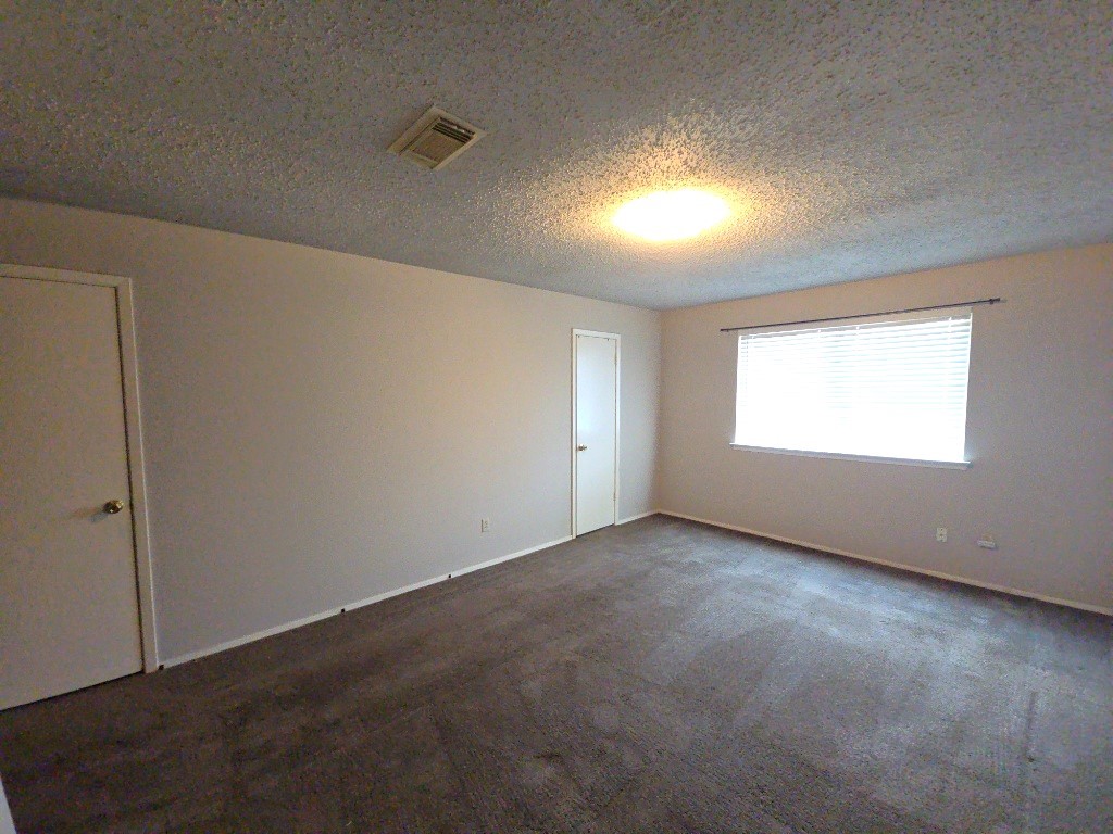 15625 Weldon Drive Houston, TX 77032 - Photo 9 of 25 an empty room with windows