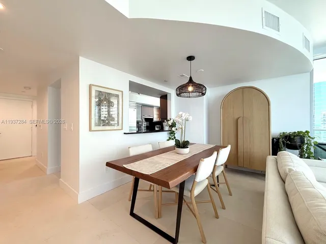 a view of a livingroom with furniture and window