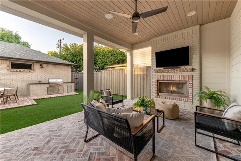 a backyard of a house with table and chairs