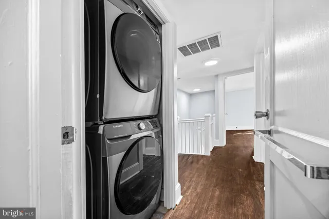 a view of a hallway with washer and dryer