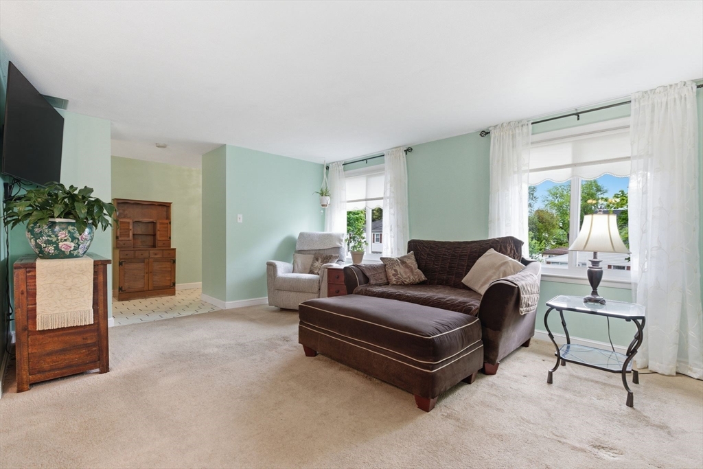 3 Spruce Street Stoneham, MA 02180 - Photo 17 of 38 a living room with furniture and a flat screen tv