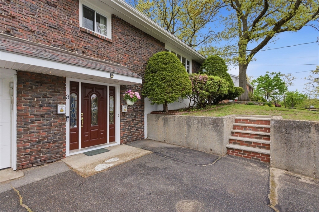 3 Spruce Street Stoneham, MA 02180 - Photo 2 of 38 front view of a house with a yard and an outdoor seating