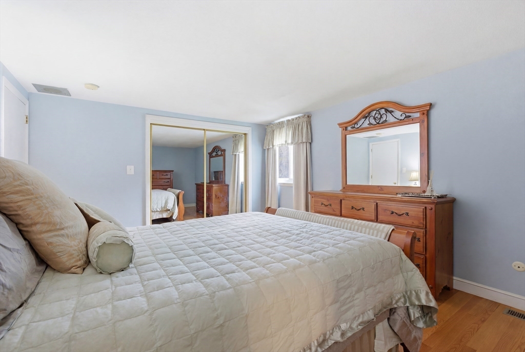 3 Spruce Street Stoneham, MA 02180 - Photo 21 of 38 a bedroom with a bed and a television