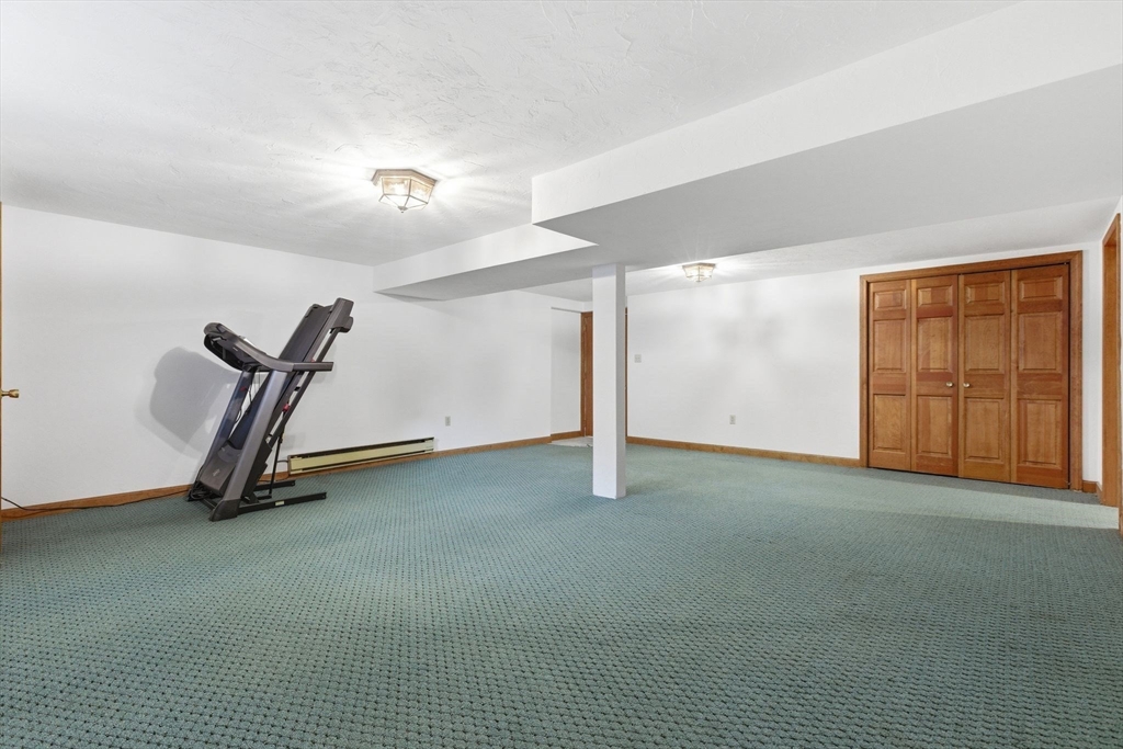 3 Spruce Street Stoneham, MA 02180 - Photo 30 of 38 a view of a room with gym equipment