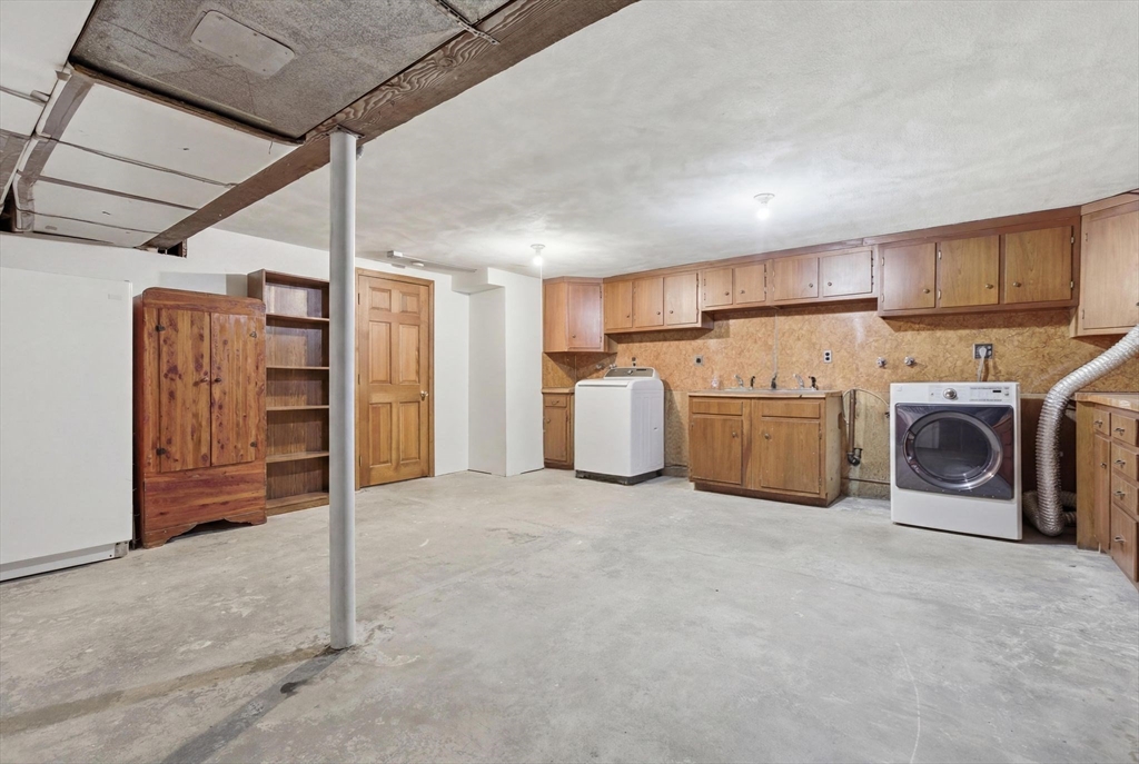 3 Spruce Street Stoneham, MA 02180 - Photo 32 of 38 a view of a kitchen with refrigerator and cabinet