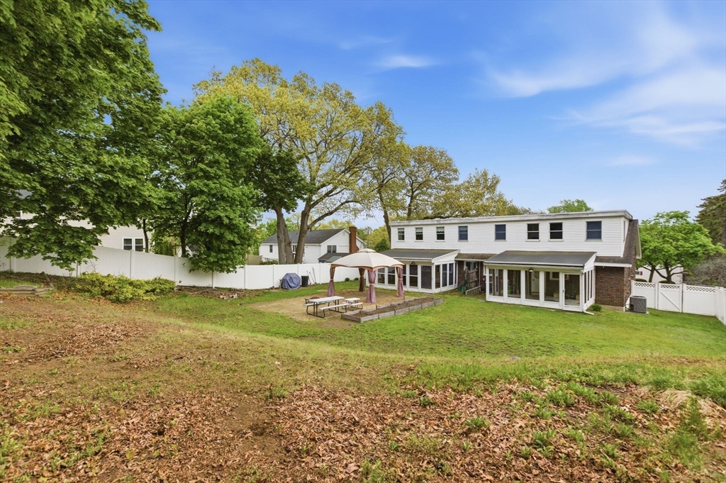 3 Spruce Street Stoneham, MA 02180 - Photo 37 of 38 a view of a house with garden and trees