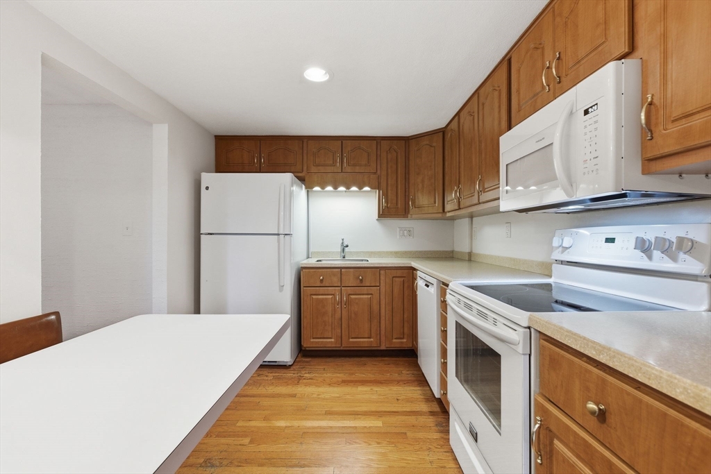 3 Spruce Street Stoneham, MA 02180 - Photo 4 of 38 a kitchen with cabinets appliances and a window