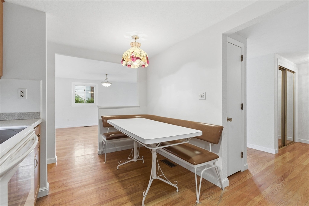 3 Spruce Street Stoneham, MA 02180 - Photo 5 of 38 a view of a dining room with furniture and wooden floor