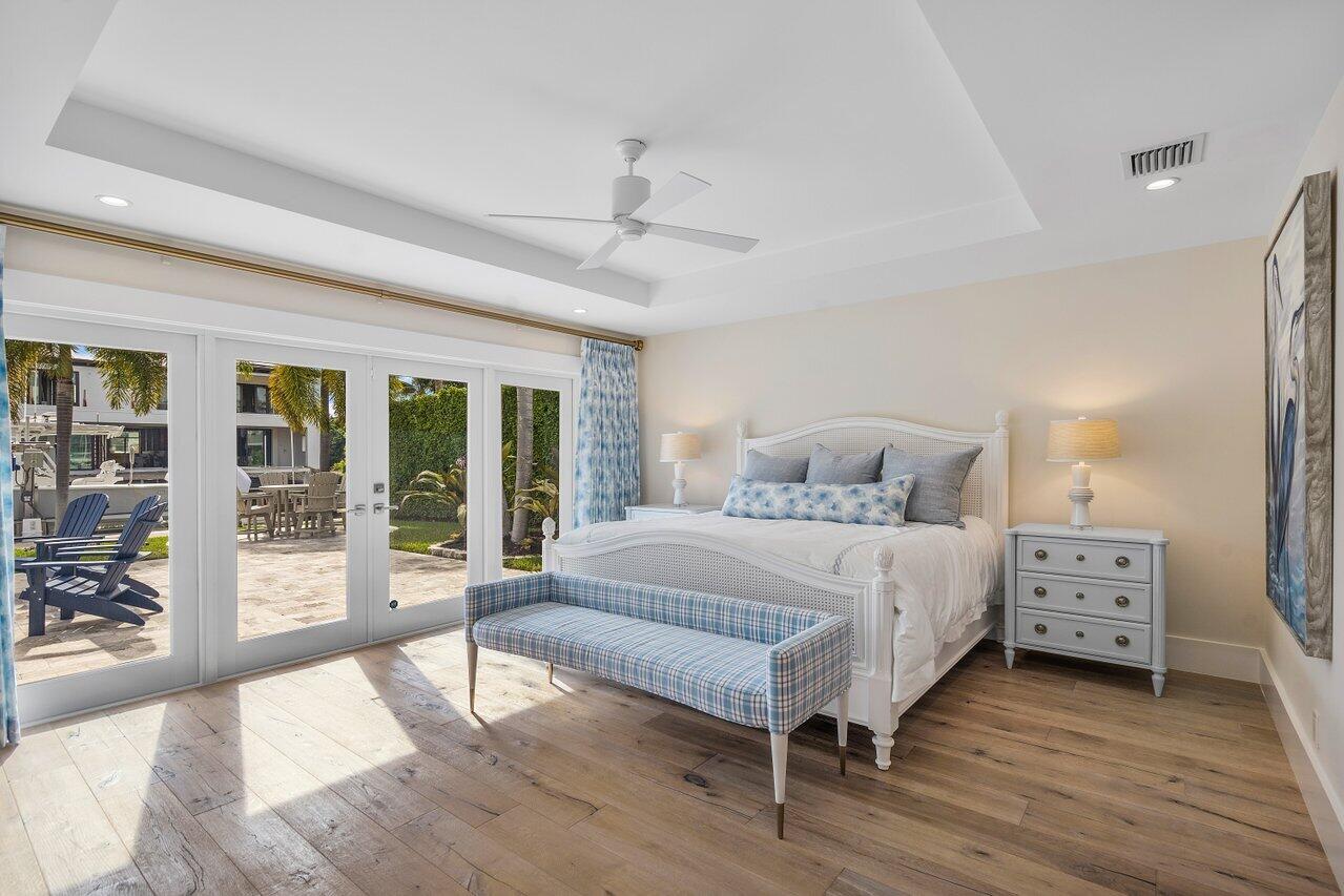 1041 Gulfstream Way Singer Island, FL 33404 - Photo 15 of 41 a bedroom with a bed and a large window