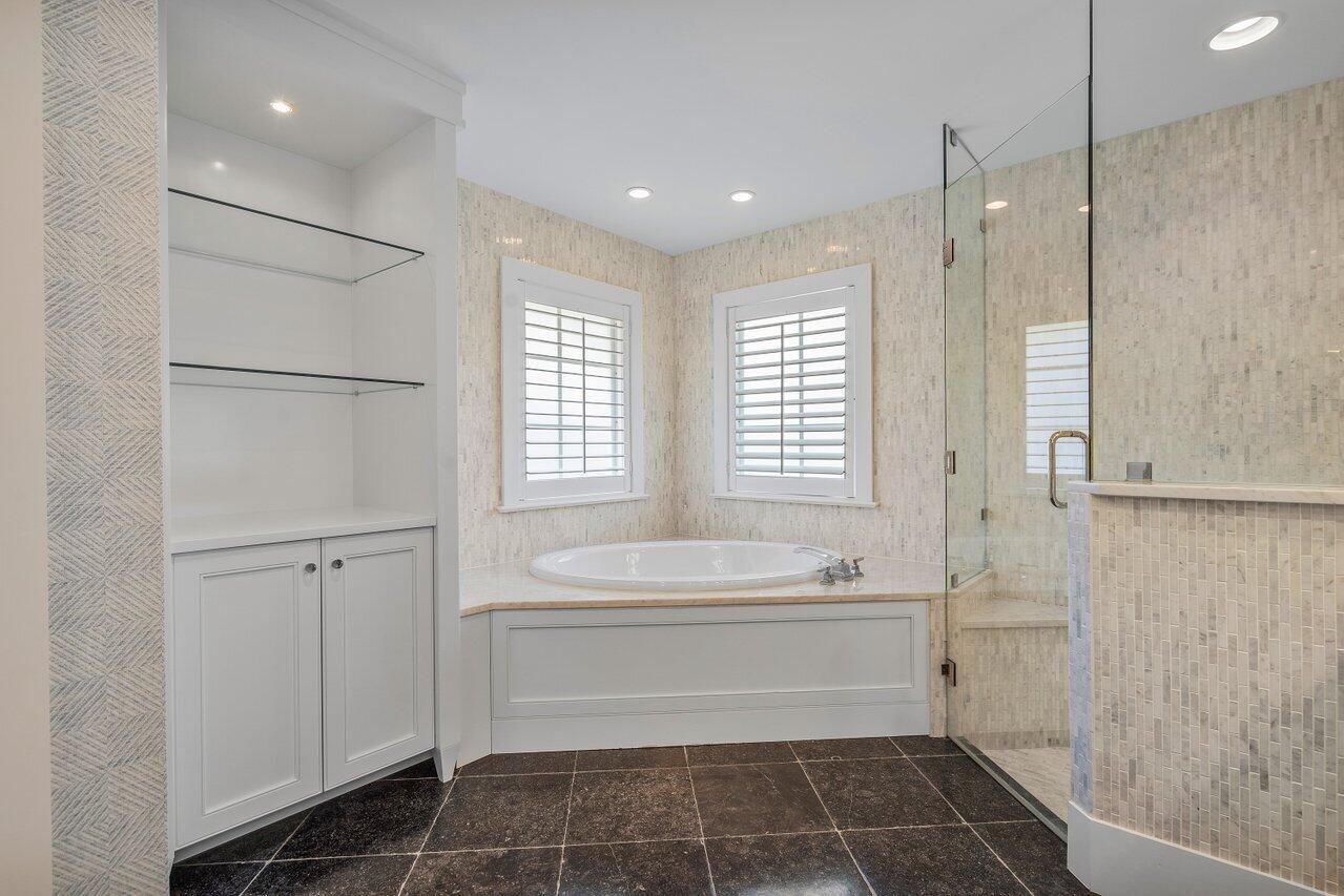 1041 Gulfstream Way Singer Island, FL 33404 - Photo 19 of 41 a bathroom with a bathtub and a sink