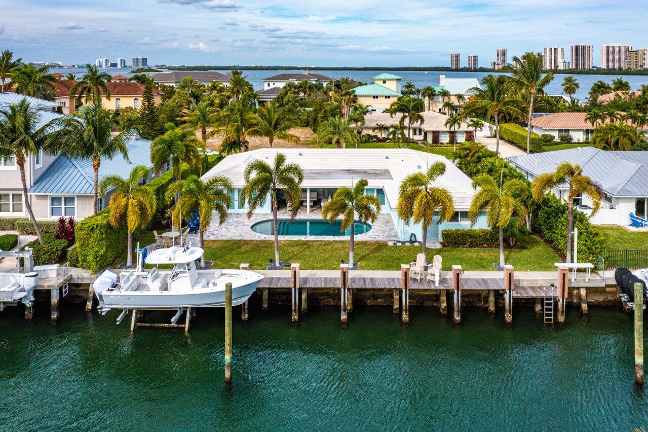 1041 Gulfstream Way Singer Island, FL 33404 - Photo 2 of 41 a view of a chairs and tables in the patio