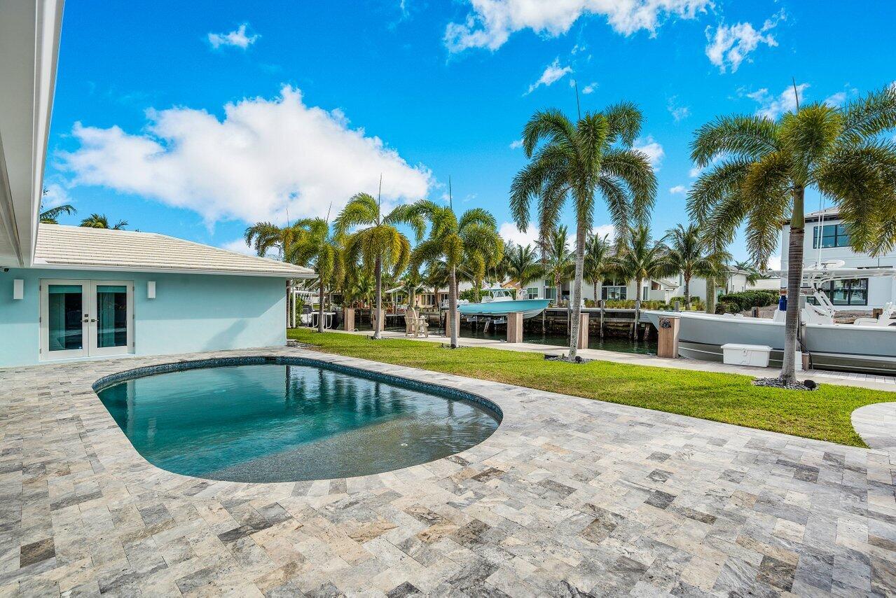 1041 Gulfstream Way Singer Island, FL 33404 - Photo 28 of 41 a view of swimming pool with a yard