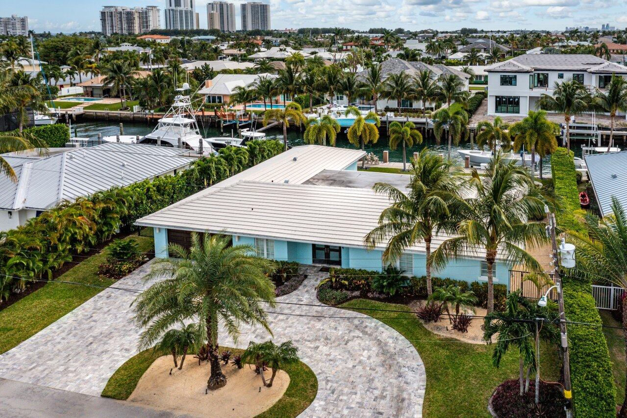1041 Gulfstream Way Singer Island, FL 33404 - Photo 32 of 41 a aerial view of a house with a yard basket ball court and outdoor seating