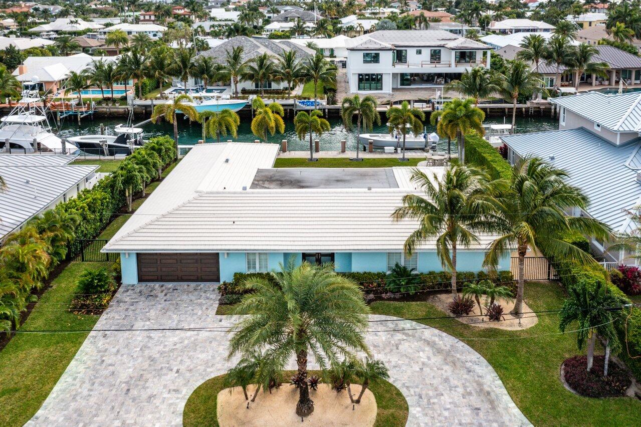 1041 Gulfstream Way Singer Island, FL 33404 - Photo 33 of 41 a view of a swimming pool with a patio and plants
