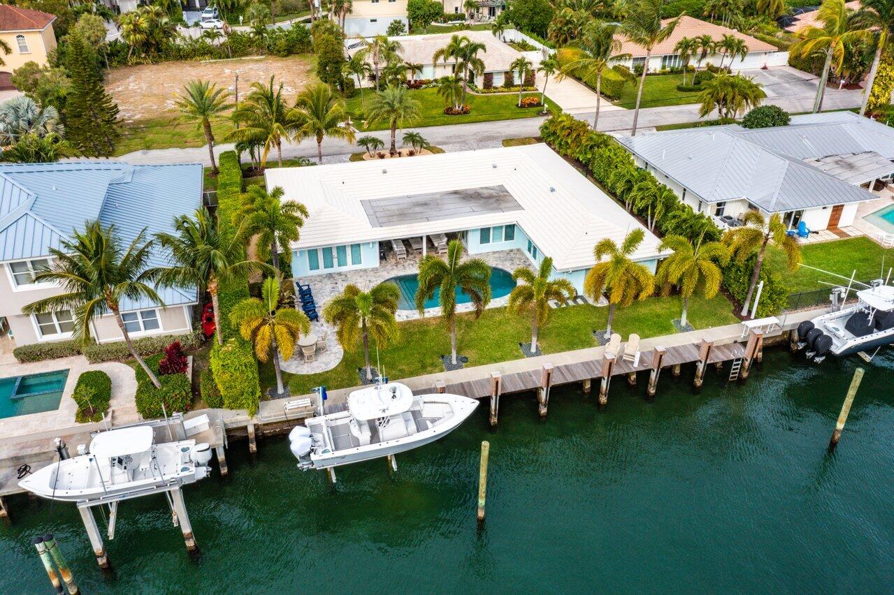 1041 Gulfstream Way Singer Island, FL 33404 - Photo 35 of 41 an aerial view of a house with a garden and swimming pool