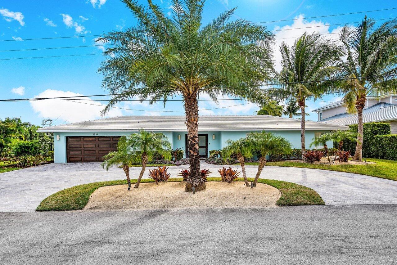 1041 Gulfstream Way Singer Island, FL 33404 - Photo 4 of 41 a view of a swimming pool with a patio